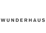 Das Wort WUNDERHAUS ist in fetten, schwarzen Großbuchstaben auf weißem Hintergrund geschrieben.