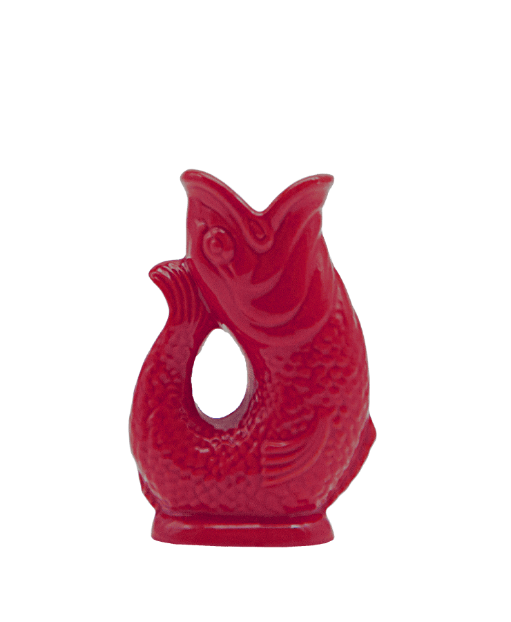 Der Gluckigluck Karaffe Mini Beerenrot von Gluckigluck ist ein glänzender, beerenroter Keramikkrug in Fischform mit gebogenem Griff und strukturierten Schuppen. Beim Einschenken ertönt das charakteristische "Gluck"-Geräusch.